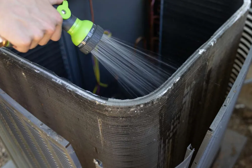 Freshwater rinse of HVAC condenser coils